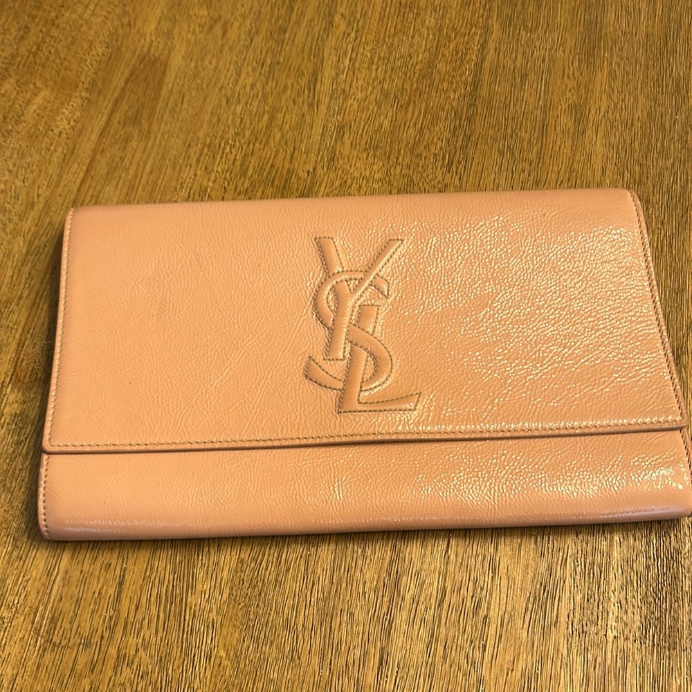 Used Yves Saint Laurent pink clutch. 26